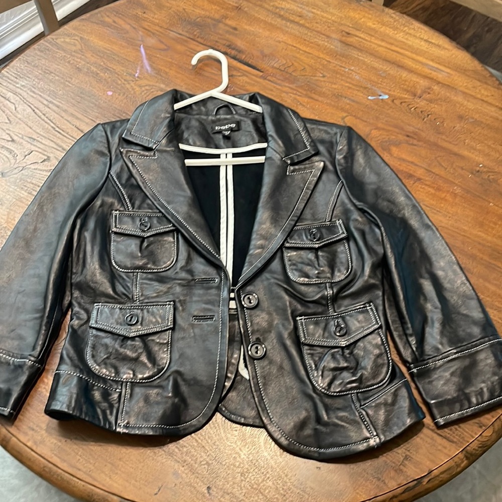 Bebe, beautiful soft black leather jacket w/white stitching. like new
